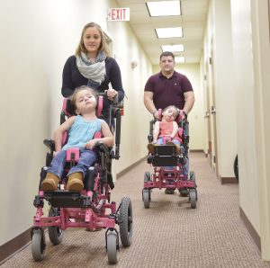 Twins with rare disease receive custom wheelchairs from Mon Health